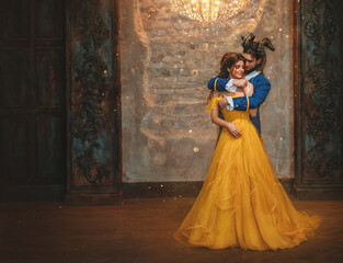 Couple embrace in room old castle. Happy beauty woman fantasy princess in yellow dress and guy is...