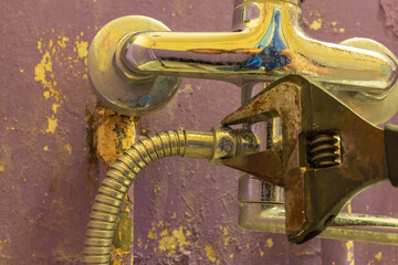 repair of an old water tap with an adjustable wrench
