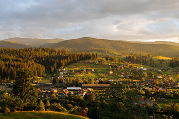 Vorokhta village is located on the green slopes of Carpathian Mountains. Sunset. Ukraine