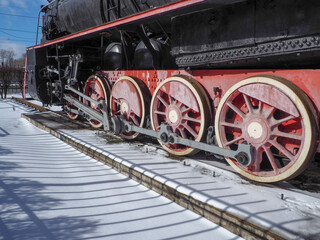 Fototapeta na wymiar red wheels of a retro steam locomotive