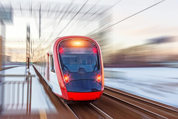 High speed modern commuter train red lights, motion blur.
