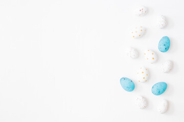 Flat lay easter composition with easter eggs on a light background