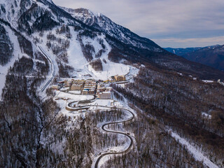 Aerial view to ski resort Krasnaya Polyana (ex. Gorki Gorod). Beautiful winter landscape from drone.