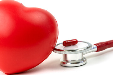Red heart with stethoscope on white background