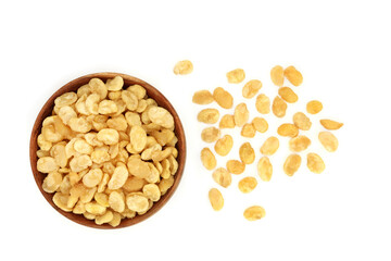 Roasted & salted fava beans for a healthy vegan & vegetarian snack in a wooden bowl on white background. Highly nutritious, high in protein, vitamins, dietary fibre & nutrients.