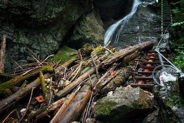 Difficul trail with ladder near the waterfall in canyon of National park Slovak paradise, Slovakia.