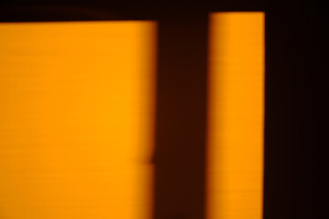 Shadows on the orange wall