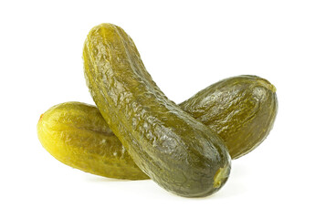 Two marinated pickled cucumbers isolated on a white background