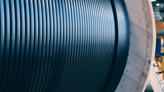 Huge spinning spool of black power cable