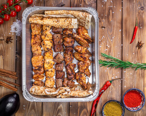 Shish Kebab and lula kebab are placed in a container.