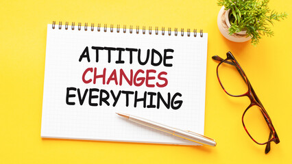 Word text ATTITUDE CHANGES EVERYTHING on white paper card, business concept