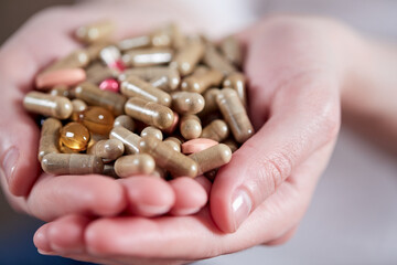 Hand of young man with pills, closeup