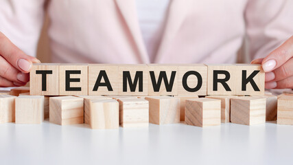 woman made word teamwork with wooden blocks