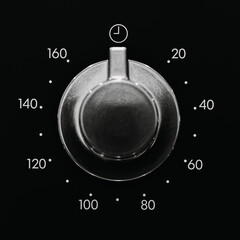 Close up of an oven time selector knob