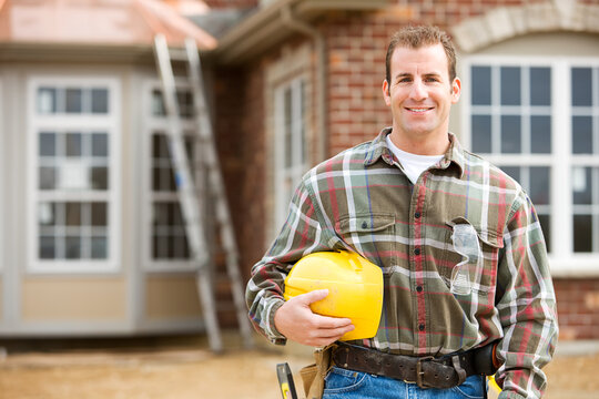 Construction: Contractor in Front of New Home