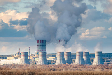 Nuclear power plant with Cooling tower of Atomic power station. Industrial zone with emission of...