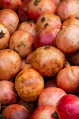 Sweet ripe red pomegranates, fruit background