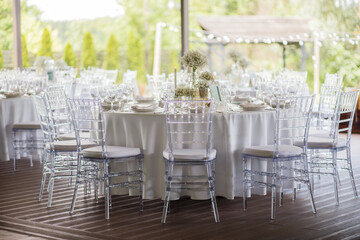 Wedding table decoration with white wildflowers and candles. Decor Celebrating concept.
