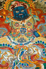 Colorful mural of a guardian deity at Songzanlin Tibetan Buddhist monastery, Shangri-la, Yunnan Province, China
