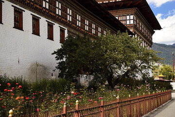 Fototapeta premium Exterior of Tashichho Dzong and its garden in the capital of Bhutan, Thimphu.