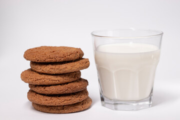oat cookies with a glass of milk isolated on white background