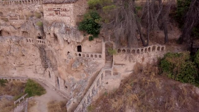 Aerial drone Landscape in Civica, a monastery cave construction in stone. An historical village, tourism destination for mystery lovers in Guadalajara, Castilla-La Mancha
