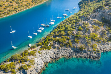 aerial view to peniscola and narrow straight with yachts