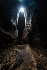 View from inside of Serracozzo volcanic cave on mount Etna, Italy
