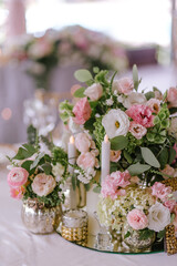 Close up of wedding decoration using different flowers and candles. Natural decorating for wedding tables for guests 