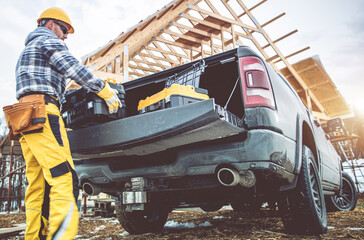 Construction Worker Taking Tools Boxes From His Pickup Truck © Tomasz Zajda