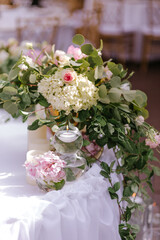 Close up of wedding decoration using different flowers and candles. Natural decorating for wedding tables for guests 