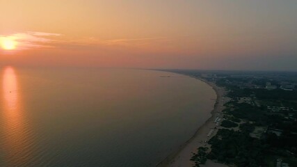 Sunset on the black sea coast view from a drone on the beach of the city of anapa