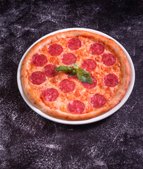 Pepperoni Pizza with sausage. Top view. Unhealthy food