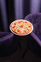 Tasty pizza. Italian food . purple background