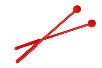 Red drum sticks. Drumsticks are red in color. On a white background, isolated.