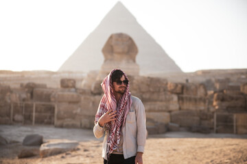 Man in front of the Pyramids of GIza and the Spinx Egypt travel