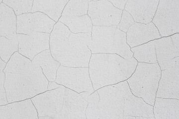 Old wall with cracked plaster. Weathered rough surface. Vintage texture is perfect for background and design.