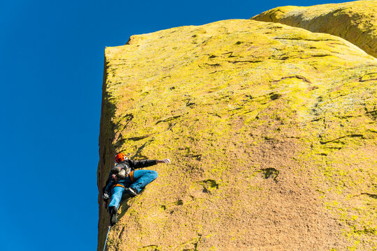 A man rock climbing the Tombstone, West Cochise Stronghold, Dragoon Mountains, Tombstone, Arizona.