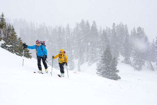A couple backcountry skiing in Commodore Gulch, Red Mountain Pass, Uncompahgre National Forest, Ouray, Colorado.