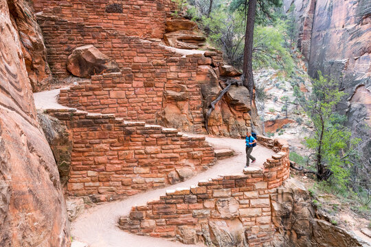 A woman hiking Angel's Landing,  West Rim Trail, Zion National Park, Springdale, Utah.