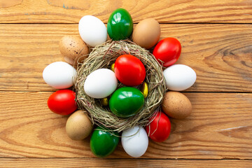 Happy Easter holiday background, Easter eggs as the color of the Italian flag - green, white, red in nest.