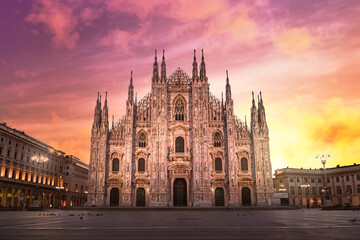 Milan Cathedral (Duomo di Milano) at sunrise, with red and orange sky during lockdown (red zone), empty square with no people - obrazy, fototapety, plakaty