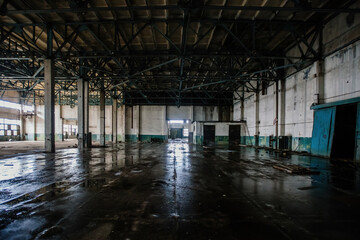 Old abandoned large industrial hall. Empty warehouse
