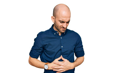 Young hispanic man wearing casual clothes with hand on stomach because indigestion, painful illness feeling unwell. ache concept.