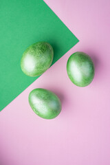 Three easter egg painted in green color. Flat lay, top view. Copy space for text