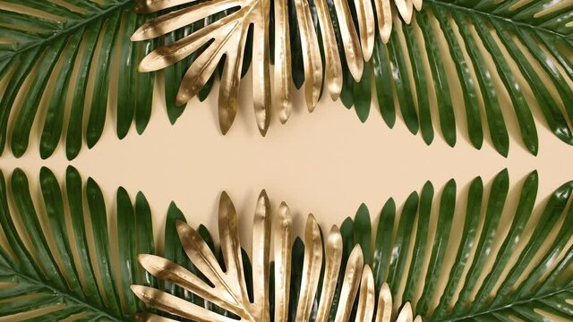 Green and gold tropic palm leaves appear on top and bottom of sandy background with copy space. Stop motion flay lay 