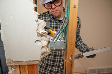 Inspecting electrical work during a home renovation