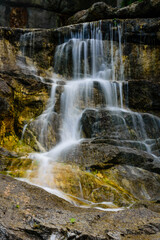 Beautiful waterfall on small river in a park