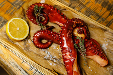 octopus and lemon platter on utensils