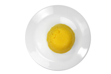 Polenta in a plate isolated on white.